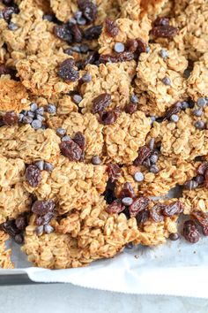 granola and raisins are arranged on top of each other in a baking pan