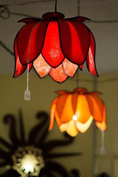 two red and orange lights hanging from the ceiling