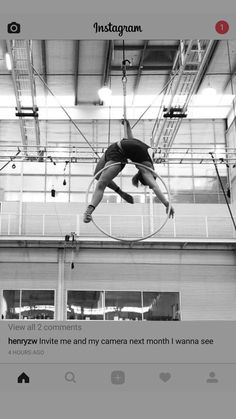 a man is suspended in the air on a pole