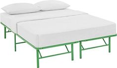 a bed with two white pillows on top of it and a green frame around the headboard