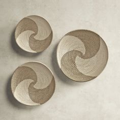 three small bowls sitting on top of a table