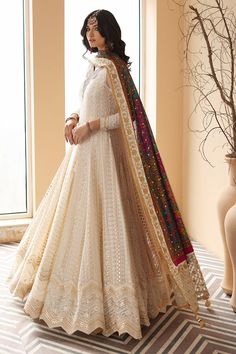 Cotton Net Off-White Angrakha for Pakistani Wedding Dresses comes in Dewy off-white embroidered kalidaar pishwas, handworked neckline, silk printed multicolored dupatta with embroidered, white border on the edges. White Angrakha: The Pakistani Wedding Dresses make a beautifully crafted frock in white that features gorgeous Sitara accents and sparkling embroidered Layered cotton net base and slip. An emerald white, ensemble is enhanced with hand embroidery on the front and sleeves. Trouser: Dress Desi Dress, Pengantin India, Desi Wedding Dresses, Shimmer Fabric, Pakistani Wedding Outfits, Pakistani Fancy Dresses, Pakistani Fashion Party Wear, Beautiful Pakistani Dresses, Salwar Kamiz