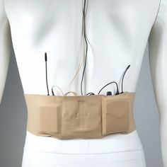 an electronic device attached to the back of a mannequin's torso,