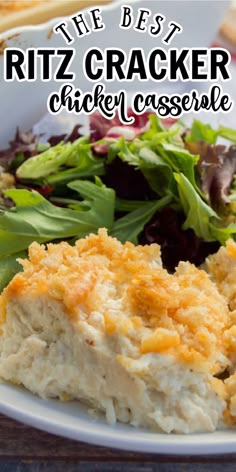 a white plate topped with chicken casserole next to bread and salad on a table