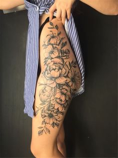 a woman's thigh with flowers on it