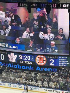 an ice hockey stadium with fans watching the game