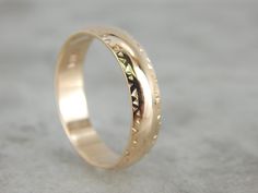 This polished band features a smooth inside, and low domed top. This is comfortable to wear, and the hatched triangle pattern and simple style that makes for a nice profile on the hand. Metal: 14K Yellow Gold Width of Band: 4.9 mm Height off Finger: 1.3 mm Size: 8.50 Marks: "14K" Stamped on the inside band Adjustable Thick Band Wedding Bands, Adjustable Thick Band Wedding Ring, Adjustable Thick Band For Wedding, Adjustable Dome Ring For Wedding, Adjustable Wide Band Engraved Ring For Wedding, Rose Gold Wedding Band, Vintage Rose Gold, Motif Vintage, Rose Gold Wedding Bands