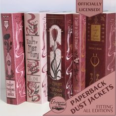 three pink books with floral designs on them