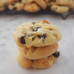 three cookies stacked on top of each other with chocolate chips in the middle and one cookie missing