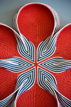 a red and blue plate sitting on top of a table