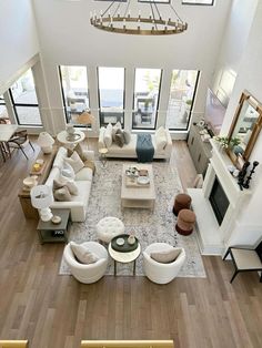 an aerial view of a living room with high ceilings