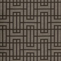 an area rug with brown and black squares on it