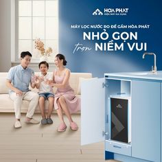 a man and woman sitting on a couch in front of a blue cabinet with the words hoi ngg gon from niem vui