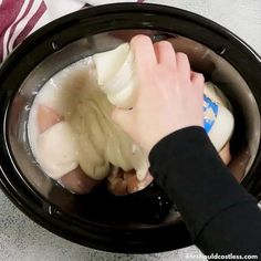 the person is washing their hands with soap in an electric bowl on the counter top