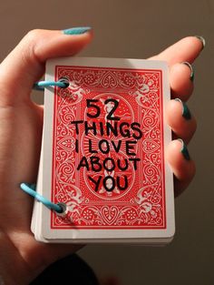 a woman's hand holding a playing card with the words 5 things love about you on it