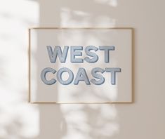 the west coast sign is hanging on the wall