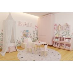 a child's room with pink furniture and flowers on the walls, carpeted flooring