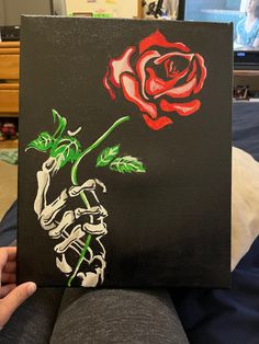 Skelton hand holding a rose, acrylic painting Spooky Couple Painting Ideas, Acliric Art Ideas, Cool Easy Canvas Paintings, Colorful Art Easy, Music Paintings On Canvas, Scary Canvas Painting Ideas, Ideas For Drawing On Canvas, Painting Gift Ideas For Boyfriend