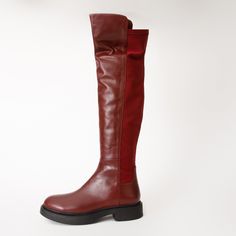 Materials Upper: LeatherLining: LeatherSole : Rubber Harmony Belle Burgundy Leather Knee High Women Boot Material and Craftsmanship: Meticulously handcrafted from 100% genuine cowhide leather. The boot features an elastic fabric on the back for a custom fit on every leg. Convenient side zipper for easy wear is located on the outer side. Comfortable Insole: Utilizes a natural padded leather insole for enhanced comfort. Durable Rubber Sole: The boot is equipped with a durable rubber sole for comfo Women Boot, Easy Wear, Cowhide Leather, Custom Fit, Knee High, Rubber Sole, Womens Boots, Zipper, Boots