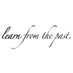 the words learn from the past written in black ink