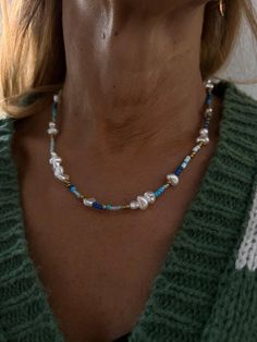 handmade necklace from different shades of blue beads whit sweet water like pearl's.  Nylon thread with a silver colored clasp  {the clasp might loose color in water} Blue Pearl Necklaces With Colorful Beads, Blue Pearl Necklace With Colorful Beads, Blue Pearl Necklace With Charm For Beach, Blue Pearl Beads For Jewelry Making, Blue Beaded Pearl Necklace, Blue Pearl Beaded Necklaces For Beach, Blue Beaded Necklace With Pearl Charm For Beach, Adjustable Blue Pearl Necklace, Blue Pearl Necklace With Spacer Beads