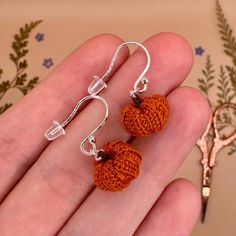 Handmade micro crochet pumpkin earrings! 🎃 each pair crafted by hand with top quality silver or gold hooks, for that perfect autumnal gift (whether for a loved one, or yourself!) 🌸 I make these earrings to order by hand with waxed cotton thread and a 0.4mm crochet hook, finished with high quality earring hooks in a metal of your choice 💛 This item makes a perfect gift for lovers of autumn, fall, Halloween, cosy fall vibes, witchy fashion, cottagecore accessories and artisanal jewellery. Each Handmade Dangle Jewelry For Fall, Handmade Jewelry For Fall Gift, Handmade Sterling Silver Halloween Earrings, Cottagecore Accessories, Pumpkin Jewelry, Silver Pumpkins, 4mm Crochet Hook, Witchy Fashion, Pumpkin Earrings