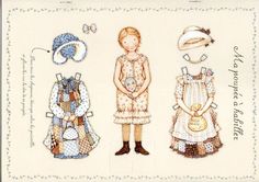 three children's dresses and hats are shown on a card