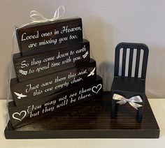 a stack of wooden blocks sitting on top of a table next to a small chair