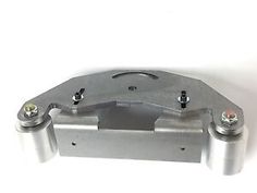 an image of a metal object with two screws on the front and one in the back