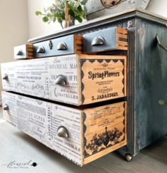 an old dresser is decorated with newspaper boxes