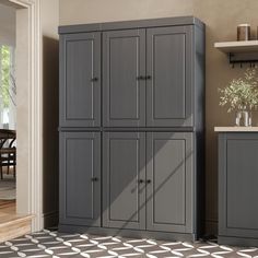 a kitchen with gray cabinets and white counter tops