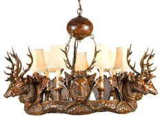 a chandelier with deer heads and lamps on it