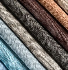 many different colors of fabric are arranged in the same pattern and color scheme, including brown, blue, green, gray, white