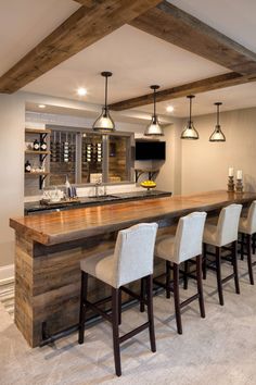 an image of a kitchen setting with bar and stools in the center, on instagram