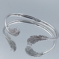 Authentic Vintage  Elegant hinged Bangle  Swarovski Crystal Pave    The feather is a popular jewelry motif right , and this elegant hinged bangle offers a very refined and easy-to-wear  Exquisitely crafted with shimmering crystal pavé, it will add polished chic to your fall/winter outfits and beyond. Stack with other rhodium plated styles or a Swarovski watch for extra sparkle. The item is 100% genuine Excellent condition We invite you to visit our stores Jewelry Store https://www.etsy.com/shop/ Swarovski Watch, Swarovski Watches, The Bangles, Popular Jewelry, Elegant Bracelet, Vintage Elegant, Hinged Bangle, Accessories Store, Fall Winter Outfits