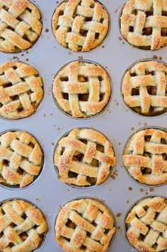 freshly baked mini pies in muffin tins ready to be baked into the oven