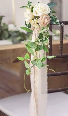 a bouquet of flowers sitting on top of a chair