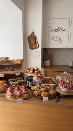 an assortment of pastries and desserts on display