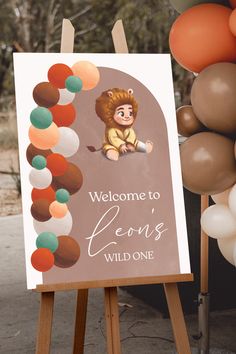 a welcome sign with balloons in the background and a lion on it's back