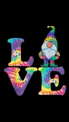 the word love spelled in tie - dye with a gnome on it's head