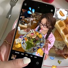 a person holding up a cell phone with food on it and an image of a woman eating