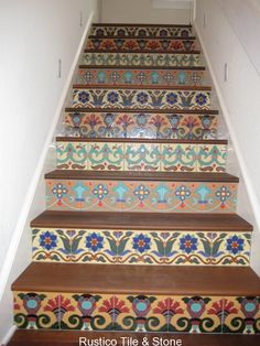 the stairs are decorated with colorful tiles