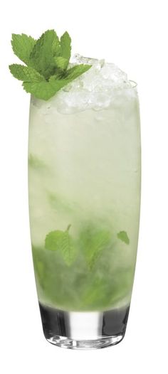 a tall glass filled with ice and mint