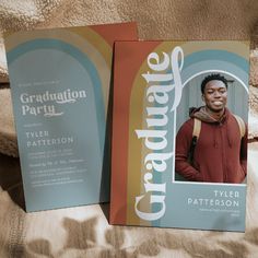 two graduation announcements are sitting on a bed with the same color and pattern as they appear