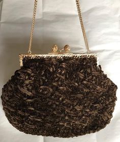 "This is a very nice bag - the woven fur like materials gives it a nice, unique look and softness. The frame is gold metal and the clasp is two large faux pearls. The lining is brown silk and it has chain. This bag is in great vintage condition and is great for a fancy evening event. Measurements Width - 9: Hight 6 3/4 Drop 6\" Happy to answer any questions about this item Please note that my store does not accept returns and does not ship internationally" Pearl Clasp, Fur Stole, Coin Purse Wallet, Top Handle Bags, Evening Purse, Brown Silk, Brown Vintage, Red Silk, Woven Bag