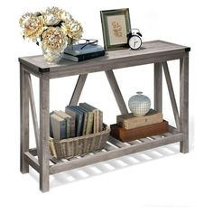 a book shelf with books and flowers on it next to a basket full of books