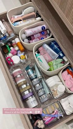 an organized drawer in a bathroom filled with personal care items