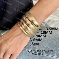 "All Our Bracelets Are Made Of REAL 14K GOLD  14K Yellow Gold Textured Bangle Bracelets, 5mm 6mm 8mm 10mm 13.5mm Thick, 7\" 8\" Inch, Stackable Bangles, Real Gold Bangle, Women  Shop our 14K Bracelets https://www.etsy.com/shop/GOLDMANIA?ref=seller-platform-mcnav§ion_id=26925987  Shop On Sale items https://www.etsy.com/shop/GOLDMANIA?ref=seller-platform-mcnav§ion_id=1  Metal: 14K Yellow Gold Width: 5mm, 6mm, 8mm, 10mm, 13.5mm  Length: 7\", 8\" Inch Closure: Box  5mm    7\"-  4.9 Gram 5mm   8\" - Gold Hallmarked Cuff Bracelet In Fine Jewelry Style, Gold Hand Set Cuff Bracelet, Traditional 14k Gold Wedding Bracelet, Gold Engraved Bangle Fine Jewelry, Gold Hallmarked Bangle Fine Jewelry, Gold Diamond Cut Bangle Fine Jewelry, Gold Diamond Cut Bracelets For Wedding, 14k Gold Ceremonial Bangle, Ceremonial 14k Gold Bangle