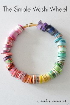 the simple washi wheel bracelet is made with different colors and sizes of paper strips