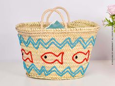 Perfect for Beach Vacations and Poolside Relaxation Make a splash this summer with our Embroidered Fish Motif Summer Bag. This unique beach tote is not only practical but also a fashion statement. The bag features a charming embroidered fish motif, adding a touch of whimsy to your beach or poolside look.The bag is spacious enough to hold all your summer essentials, from sunscreen to your favorite summer read. It's made from durable materials, ensuring it can withstand the rigors of summer advent Embroidered Beach Bag For Summer Shopping, Summer Embroidered Beach Bag For Shopping, Embroidered Beach Straw Tote Bag, Embroidered Straw Tote Bag For Beach, Casual Embroidered Beach Bag For Vacation, Embroidered Rectangular Straw Bag For Beach, Embroidered Natural Beach Bag For Vacation, Embroidered Bucket Bag For Beach, Blue Embroidered Beach Bag